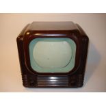 A Bush type 22 table television receiver,1950, 405-line, 8-inch screen, cream mask, in moulded brown