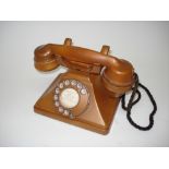 An unusual 200-series gold-finished Bakelite telephone, Impressed mark 164-56, with faux-wire braid,