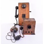 Three early telephones: A GEC wooden magneto wall telephone with Bakelite receiver, toggle call