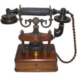 A rare type 26 table telephone, by Sterling, Two-way button handset, scroll cradle, exposed bell