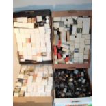 A large selection of tested wireless valves: Mostly boxed, with hand-written percentage results,
