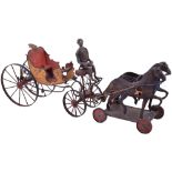 An unusual tinplate open carriage with coachman and two horses, probably German circa 1890