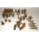 Various hollowcast toy soldiers in khaki, steel helmets and puttees