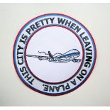 Adam Bridgland This city's pretty when leaving on a plane embroidered patch signed 30cm diameter