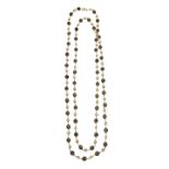 Long necklace in yellow gold, garnets and pearls MATERIAL: yellow gold, garnets and pearls