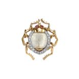 Gold brooch in white, yellow gold, bone, rubies and diamonds MATERIAL: white, yellow gold, bone,