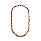 Yellow gold low title necklace. red coral and onyx MATERIAL: gold low titer, red coral and onyx