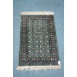 Small green ground Bokhara type rug,