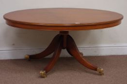 Yew wood oval coffee table on fluted supports, W118cm, D77cm,