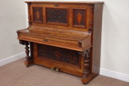 Late 19th century German upright piano in carved walnut case by Robert Westphal Berlin, W148cm,