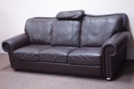 Three seat traditional design sofa upholstered in dark brown leather with studded detail,