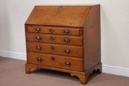 George 111 oak bureau, fall front above four drawers on bracket feet, W98cm D50cm,