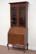 Edwardian bureau bookcase, enclosed by two astragal glazed doors, fall front above three drawers,