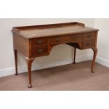 Early 20th century walnut kneehole dressing/writing table, five drawers, W130cm, H81cm,