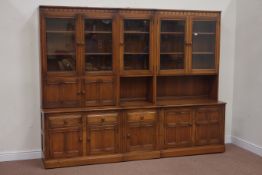 Ercol three section wall unit with glazed and panelled doors, W248cm, x D50cm,