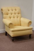 Victorian style armchair upholstered in pale yellow fabric,