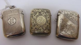 Two hallmarked silver vesta cases and another white metal vesta case Condition Report