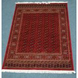 Red ground Bokhara pattern rug, 230 x 160cm Condition Report <a href='//www.