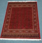 Red ground Bokhara pattern rug, 230 x 160cm Condition Report <a href='//www.