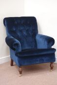 Victorian style armchair upholstered in midnight blue velvet, walnut finish turned feet,