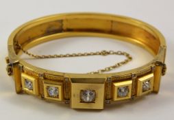 Etruscan revival hinged gold bangle set with central diamond of approx 0.