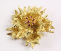 Gold petal brooch with ruby flowerhead stamped 750 approx 19gm Condition Report
