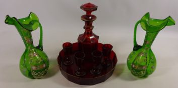 Pair of Victorian glass jugs with enamelled finish and a Victorian ruby glass decanter set