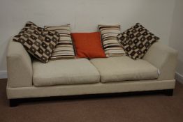 Three seat sofa upholstered in oatmeal fabric with five cushions, on tapered legs,