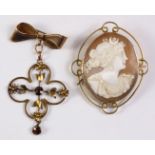 Edwardian garnet bow pendant brooch and a cameo brooch both stamped 9ct Condition Report
