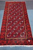 Persian red ground Bokhara rug, 326cm x 166cm Condition Report <a href='//www.