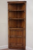 Ercol corner unit with shelves and panelled door, W74cm, D36cm,