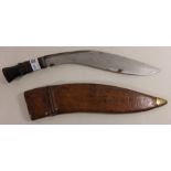 Kukri knife in hard leather sheath stamped with serial no.