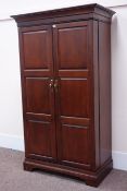 Howard Miller walnut finish drinks cabinet two panel doors enclosing fitted interior, W110cm,