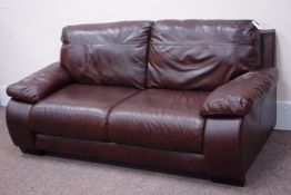 Three seat sofa upholstered in chocolate brown leather,