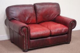 Small two seat traditional red leather sofa,