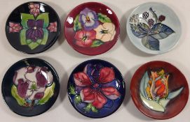 Six Moorcroft small dishes, impressed marks,