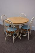 Circular lightwood extending dining table with painted base with four hoop & stick back chairs,