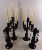 Pair of black glass candelabras and a pair of similar candlesticks Condition Report