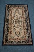 Small Persian rug and a Persian pattern hearth rug,