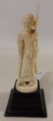19th century Indian Ivory carved model of a man with a fan, on ebonised plinth H15.