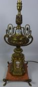 Large urn shape gilded metal table lamp with ceramic panels on marble base (This item is PAT tested