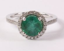 Emerald and diamond halo cluster white gold ring stamped 18k 750 (emerald approx 1.