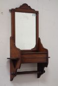 Edwardian walnut hall mirror, hinged glove box, carved pediment, W47cm, H71cm,