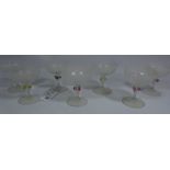 Seven 19th Century Venetian champagne glasses with latticino decoration and stems with coloured