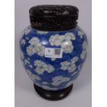 19th/ early 20th Century large Chinese blue and white ginger jar with carved wood lid and stand