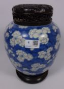 19th/ early 20th Century large Chinese blue and white ginger jar with carved wood lid and stand