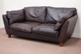 Three seat sofa upholstered in brown leather,