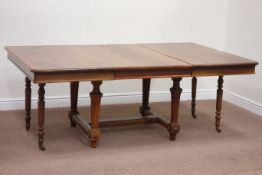 Early 20th century French walnut extending dining table with leaf on fluted supports, W194cm,