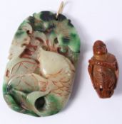 Chinese carved jade naturalistic pendant in the form of a fish with yellow metal clip 7cm and a