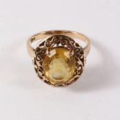 Oval cut citrine ring in raised scroll setting stamped 14c approx 5.